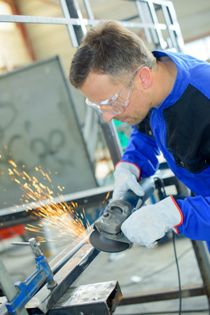 Man using angle grinder