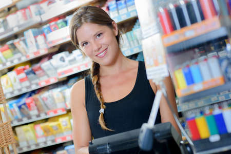 Female worker in a tobacconistの写真素材