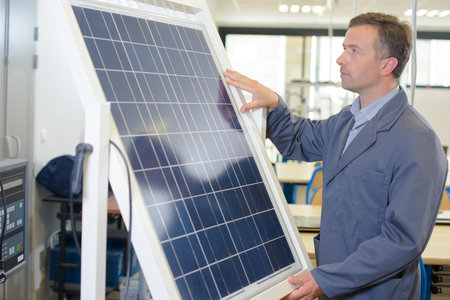 Man holding solar panel