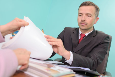 Man going through catalogue with client
