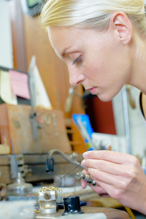 Jeweler repairing chain