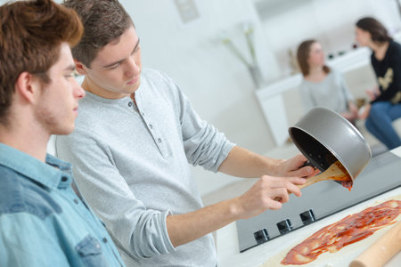 Man preparing a tomato sauce