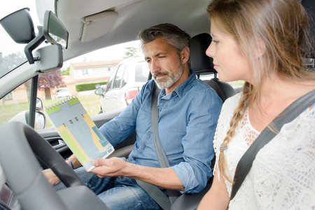 Lady with driving instructor, learning theoryの写真素材