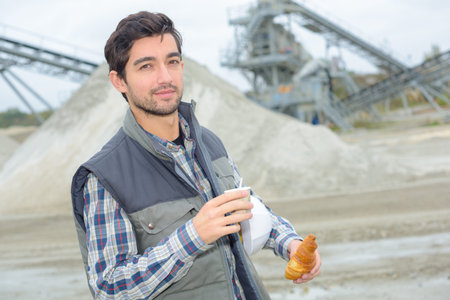 Portrait of man in quarry have breakfast on the hop