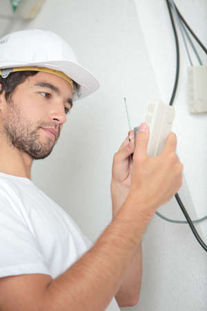 Man wiring switchの写真素材