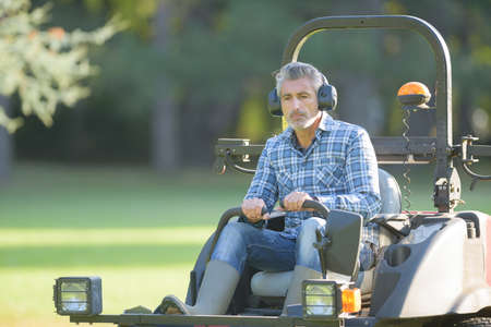 Man on rideon mowerの写真素材