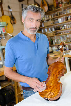 the finished repaired violinの写真素材