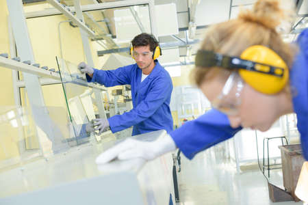 glass and workersの写真素材