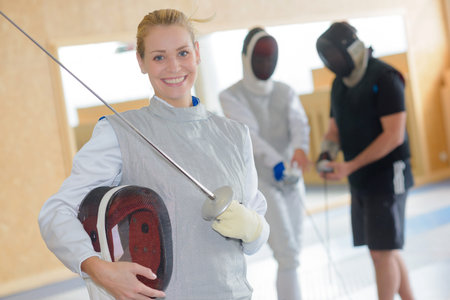 Portrait of smiling female fencer
