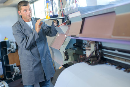 Man using printing machine
