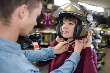 putting a helmet onの写真素材