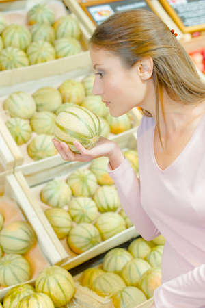woman with melonの写真素材