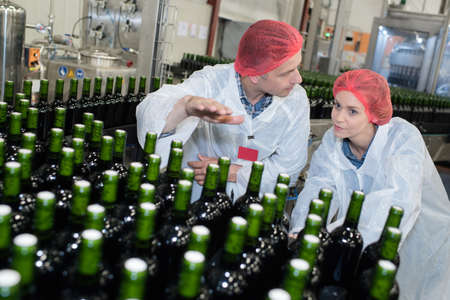 brewery team wearing a uniform inside the workshopの写真素材