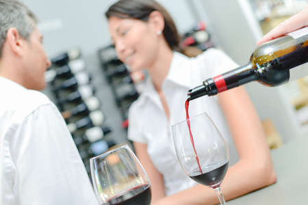 pouring wineの写真素材