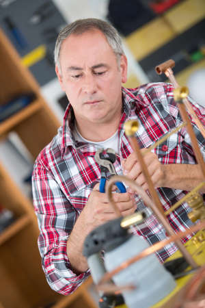 craftsman working with cooperの写真素材