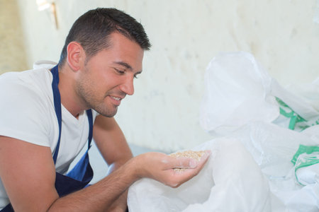 handsome man holding flour on his hand