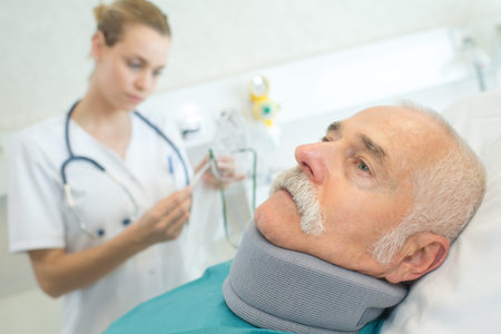 physiotherapist examining a patients neck in the clinic