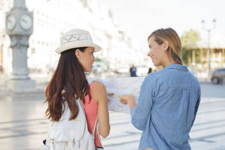 young beautiful woman travelers exploring the cityの写真素材