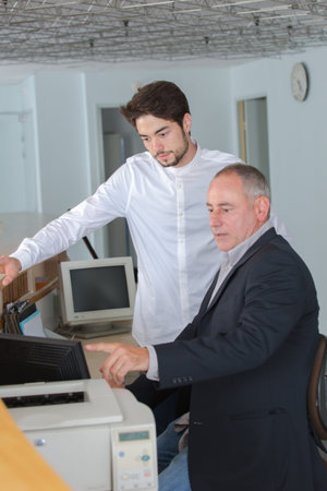 man learning to use a printer