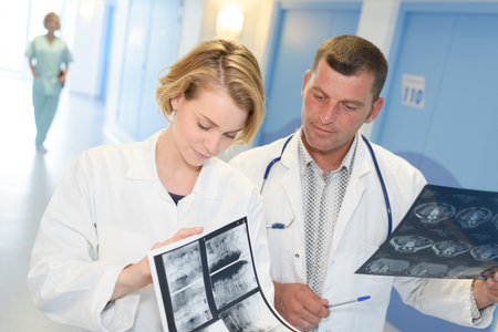 two doctors looking at x-ray