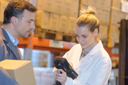 male and female in warehouseの写真素材