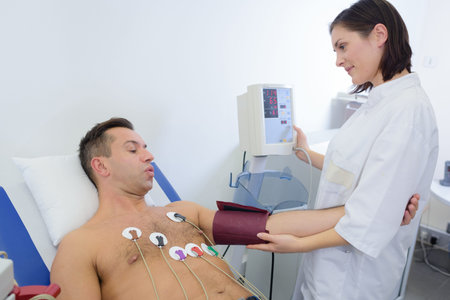 Nurse taking patient's blood pressure