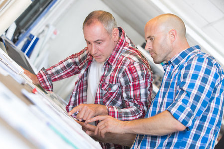 construction workers discussing plan of the building in office