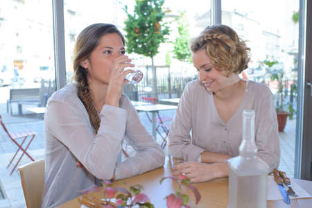 pretty women having lunch in the restaurantの写真素材