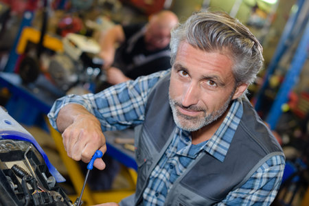 Portrait of senior mechanic