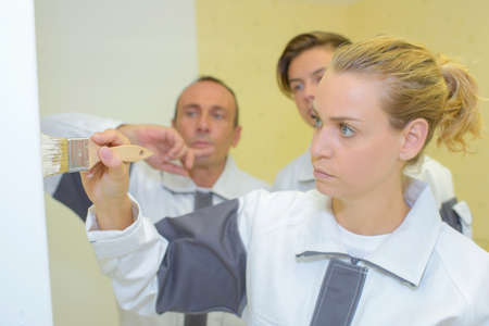 applying paint on the wallの写真素材