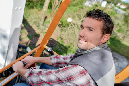 Man working, sat in cab of digger