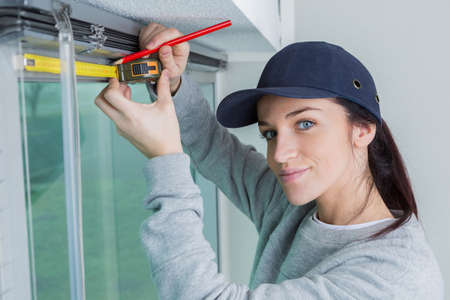 worker measuring widow blindsの写真素材