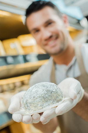 man presenting goatcheese