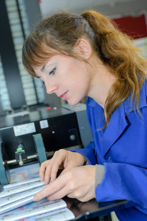 Woman looking through manual