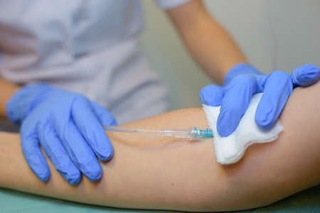 Closeup of intravenous drip in armの写真素材