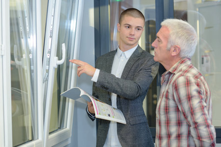 Salesman displaying double glazed windows
