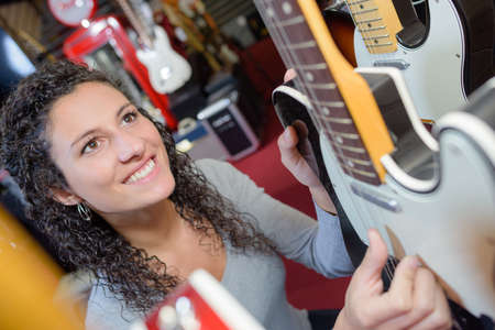 testing the guitar stringsの写真素材