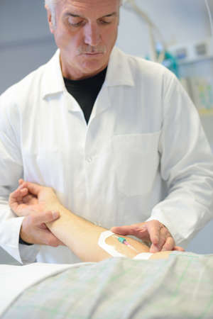 doctor examining armの写真素材