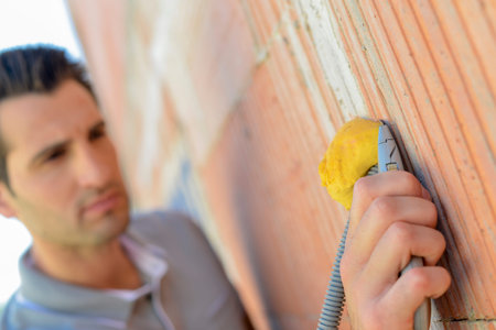 Electrician wiring a houseの写真素材