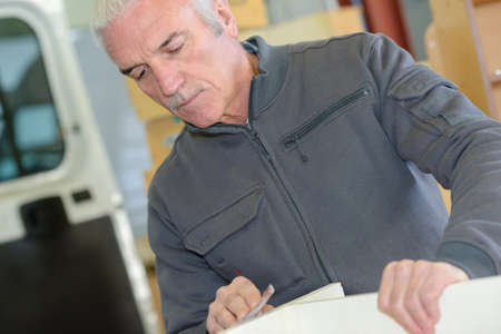 Man moving furnitureの写真素材