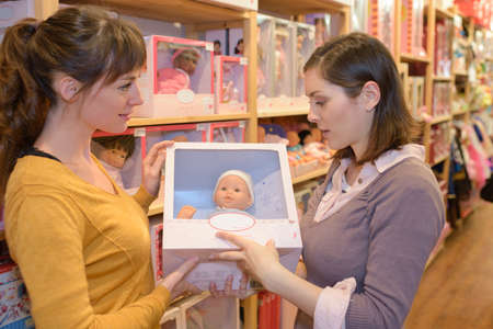 attractive customer and seller at the toy storeの写真素材