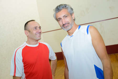 friends playing squashの写真素材