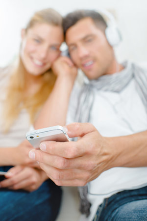 sharing the musicの写真素材