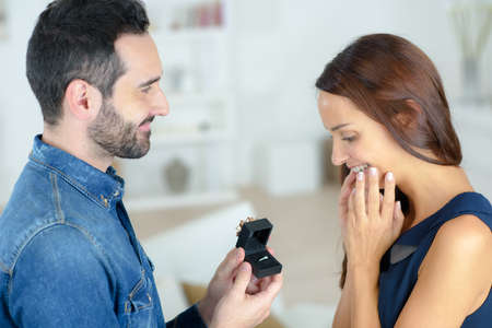 boyfriend proposing to his girlfriend with a ringの写真素材