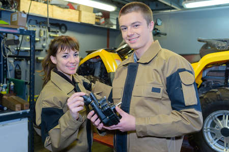 Portrait of male and female mechanicsの写真素材