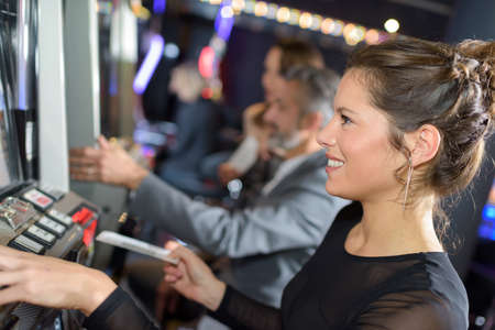 Woman playing arcade gameの写真素材