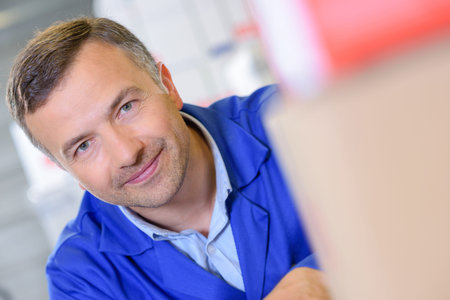 laborer posing in the workshopの写真素材