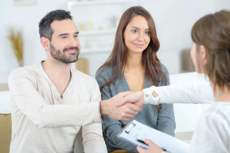 young happy couple after therapy session with psychologistの写真素材
