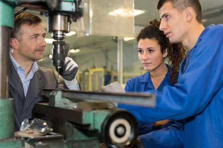 explaning the use of the machineの写真素材