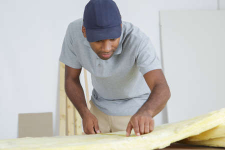 Workman measuring materialsの写真素材